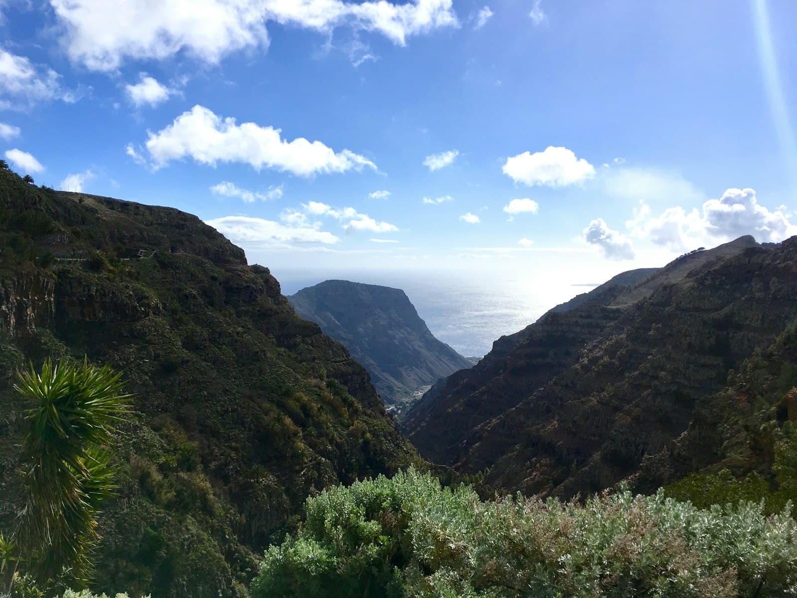 A deep valley on La Gomera with mountain ridges behind it.