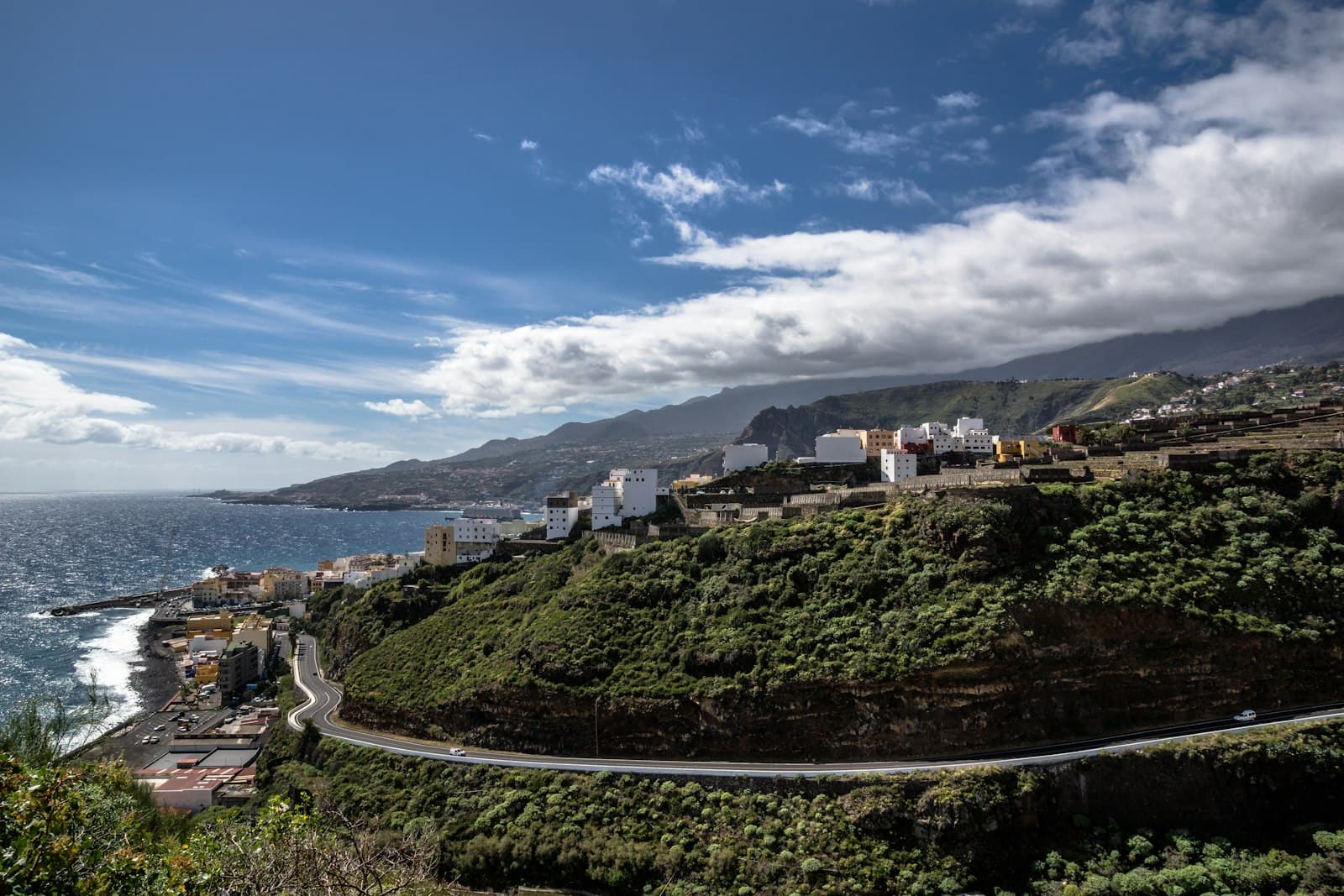 A green mountain ridge on La Palma under a clear blue sky.